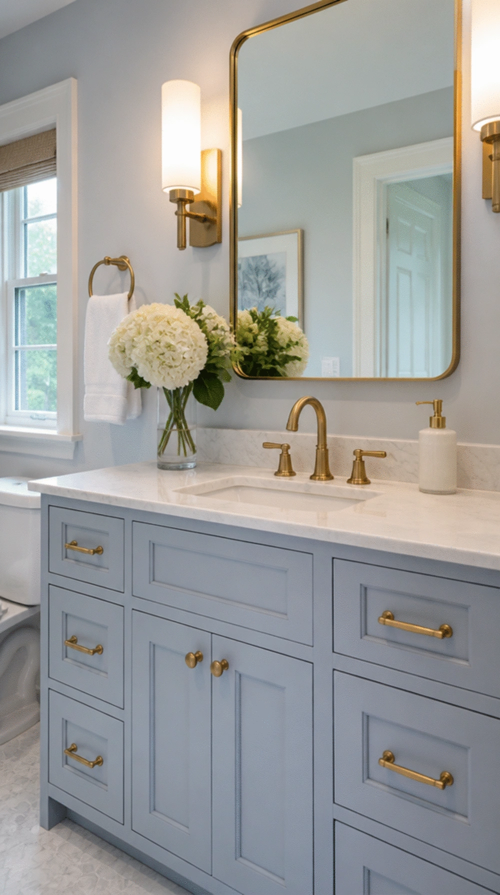 Bathroom Powder Blue Cabinet Paint Below a White Marble Countertop